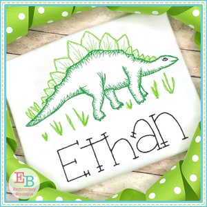 May include: Embroidered design of a green dinosaur with a name "Ethan" underneath. The dinosaur is outlined in black and has a green spiky back.