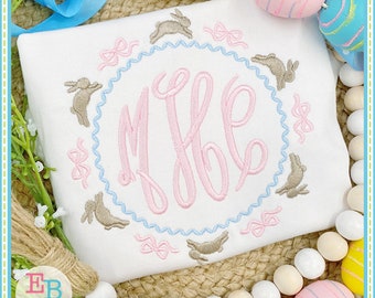 May include: A white onesie with a pink monogram "MJE" surrounded by a blue and white scalloped circle.  The circle is decorated with brown bunnies and pink bows.