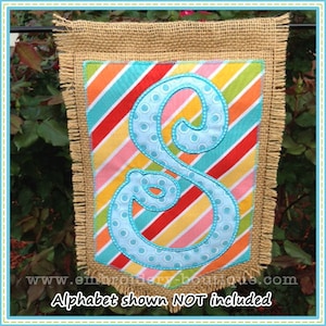 May include: A burlap flag with a fringe border and a colorful striped background. A blue letter "S" with white polka dots is sewn on the flag. The text "Alphabet shown NOT included" is at the bottom of the flag.