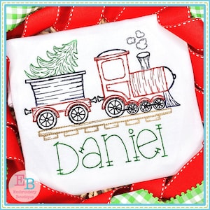 May include: Embroidered design of a red train pulling a box car with a green Christmas tree inside. The train has black wheels and gold tracks. The name "Daniel" is embroidered below the train in green.