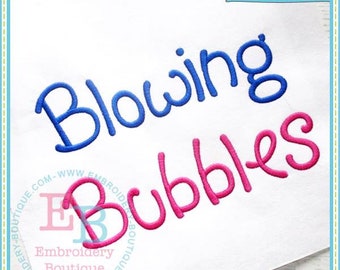 May include: White fabric with the words "Blowing Bubbles" embroidered in blue and pink thread. The top right corner has the text "EB Exclusive" in a banner. The bottom left corner has the text "Embroidery Boutique".