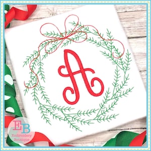 May include: Embroidered Christmas wreath with a red bow and the letter A in the center. The wreath is made of green pine branches.