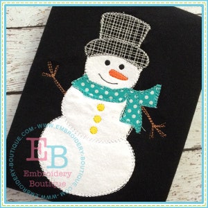 May include: A white snowman with a black top hat, a teal scarf with white polka dots, and a carrot nose. The snowman has three yellow buttons and brown twig arms. The snowman is on a black background.