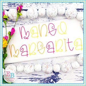 May include: A white background with a yellow and pink embroidered design that says "mango margarita".