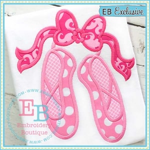 May include: Pink ballet slippers with white polka dots and a pink bow on top. The design is embroidered on a white fabric.  EB Exclusive.