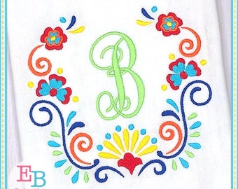 May include: Embroidered design featuring a green letter "B" surrounded by colorful floral and scroll motifs. The design is perfect for adding a personalized touch to a variety of projects.