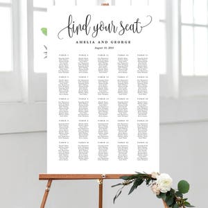 May include: A white wedding seating chart with black text. The chart is titled "find your seat" with the names Amelia and George and the date August 18, 2018. The chart lists tables 1 through 20 with guest names.