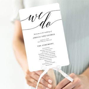 May include: A white wedding programme with the text "we do" in a cursive font. The programme lists the wedding ceremony order, including the processional, seating of the parents, bride's entrance, readings, gospel, and homily, exchange of vows and rings, lighting of the unity candle, the Lord's prayer and blessing, sign of peace, communion, presentation of couple, and recessional. The wedding is for Amelia and George on 31 August 2030 in New York City, New York.