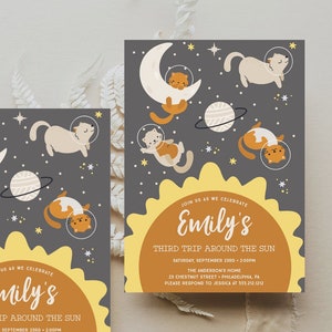 May include: A yellow and orange sun with the text "Join us as we celebrate Emily's Third Trip Around the Sun" and details for a birthday party. The background is a dark gray with stars and a white crescent moon with a cat wearing a space suit.