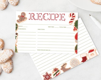 May include: A recipe card with the word "RECIPE" in red script, decorated with gingerbread men and candy canes. The card has lines for ingredients and directions. A matching lined envelope is also present, along with heart-shaped cookies dusted with powdered sugar.