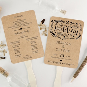 May include: Two brown paper fans with black text. The left fan lists the wedding ceremony order and the wedding party. The right fan has a floral design and the text "The Wedding of Jessica & Oliver, Sept 23, 2045, Philadelphia, Pennsylvania. We're so happy you're here!"