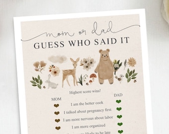May include: A printable game card with a woodland theme. The card has a title that says "Mom or Dad Guess Who Said It." The card has a list of statements about pregnancy and parenting, with two columns for players to mark whether the statement was said by the mum or the dad. The card has a brown background with illustrations of woodland animals and plants.