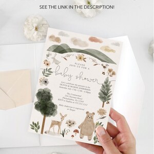 Peut inclure: Une invitation de f&ecirc;te pr&eacute;natale avec une illustration aquarelle d'une sc&egrave;ne de for&ecirc;t. L'invitation repr&eacute;sente un ours, un cerf et des fleurs. Le texte de l'invitation indique "Veuillez vous joindre &agrave; nous pour une f&ecirc;te pr&eacute;natale" et comprend les noms Olivia & Mason Anderson, la date et l'heure de la f&ecirc;te, ainsi que le lieu.