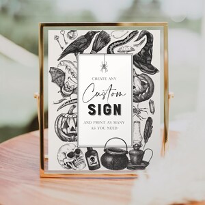 May include: A framed sign with a gold border, featuring black and white illustrations of Halloween-themed objects. The sign includes a raven, witch's hat, pumpkins, and a skull. Text on the sign reads "Create Any Custom Sign and Print as Many as You Need."