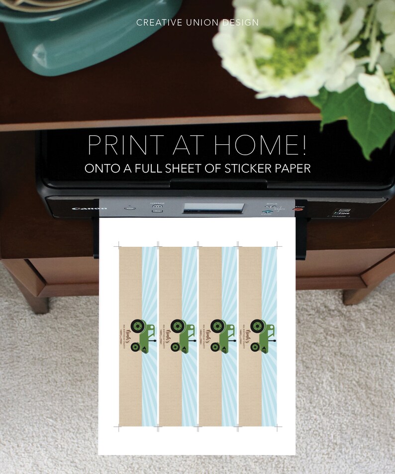 May include: A printer is printing a sheet of paper with a design featuring green tractors, blue stripes, and the text "PRINT AT HOME!" and "ONTO A FULL SHEET OF STICKER PAPER." The design also includes the text "Monk's" and "Noah's."