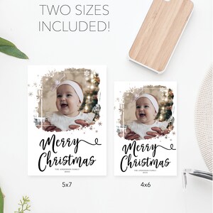 May include: Two Christmas photo cards with a baby's photo, framed with snowflakes and a distressed border. The cards read "Merry Christmas" in elegant script. One card is 5x7 inches, the other is 4x6 inches.