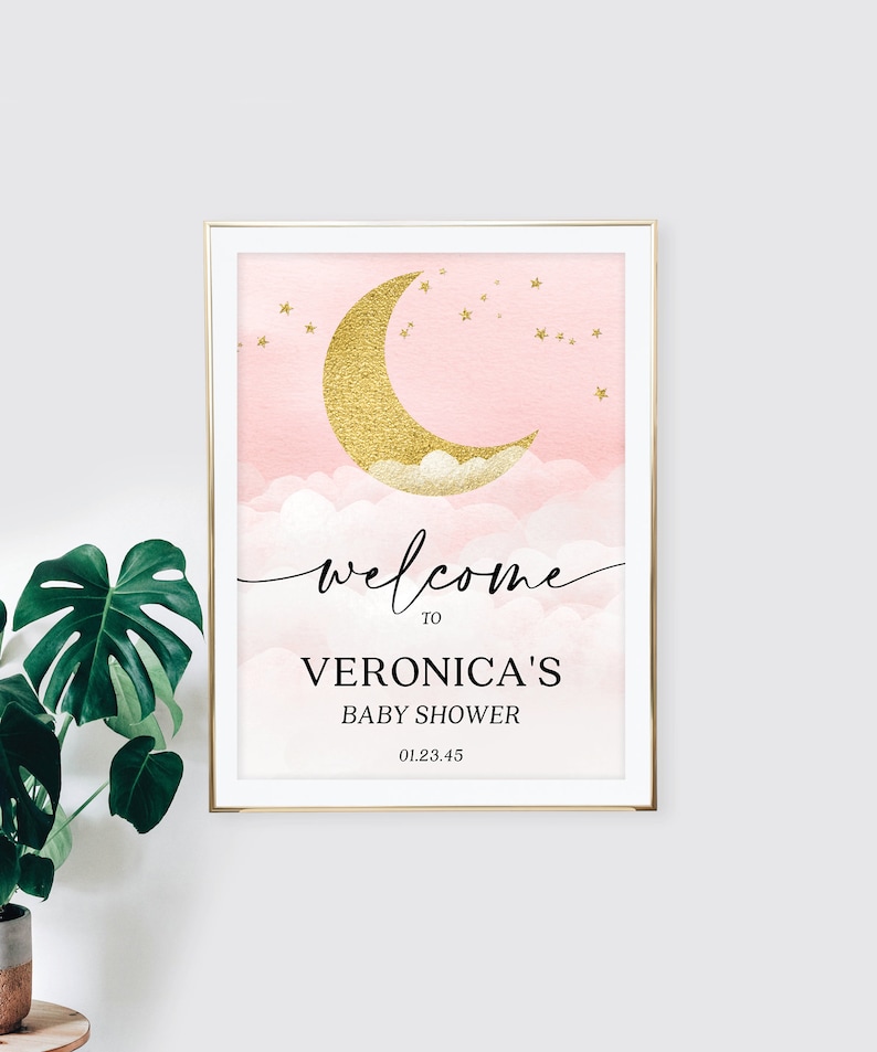 May include: A rectangular sign in a gold frame featuring a pink watercolor sky with a gold glitter crescent moon, clouds, and stars. The text reads: welcome TO VERONICA'S BABY SHOWER 01.23.45. The design uses a mix of script and serif fonts.