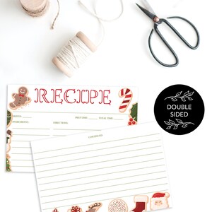 Peut inclure: Cartes de recettes sur le th&egrave;me de No&euml;l avec un bonhomme en pain d'&eacute;pices et des cannes en sucre. Les cartes sont recto-verso et comportent des espaces lign&eacute;s pour les ingr&eacute;dients et les instructions. Une bobine de ficelle et des ciseaux sont &eacute;galement dans l'image.