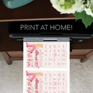May include: Two printable bingo cards with a pink and white color scheme. The cards feature a pink cowboy boot design and the text "Let's go girls Bingo".