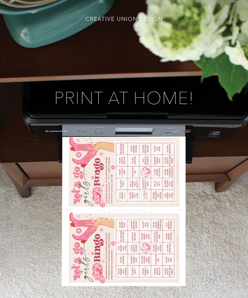 May include: Two printable bingo cards with a pink and white color scheme. The cards feature a pink cowboy boot design and the text "Let's go girls Bingo".