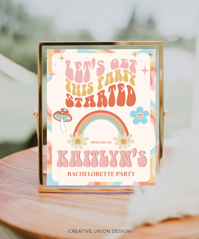 May include: A colorful sign with a rainbow, mushrooms, and flowers. The text on the sign reads "Let's get this party started" and "Welcome to Kaitlyn's Bachelorette Party".