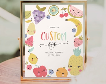 May include: A printable sign with a white background and colorful fruit illustrations. The text reads "Create any CUSTOM sign and print as many as you need."  The sign is framed in a gold frame and is sitting on a wooden surface.  The text "CREATIVE UNION DESIGN" is at the bottom of the sign.