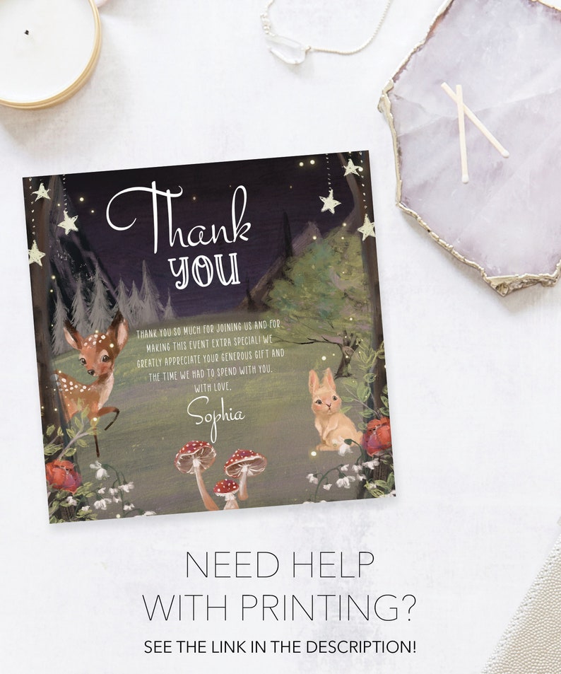 May include: A thank you card with a woodland theme. The card features a dark blue background with stars, a deer, a rabbit, mushrooms, and flowers. The text on the card reads "Thank You" and "Sophia".