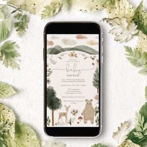May include: A digital invitation for a baby shower with a watercolor illustration of a forest scene with a deer, bear, and bunny. The text reads "Please join us for a baby shower. Let's celebrate the parents-to-be Olivia & Mason Anderson. Saturday July 17th 2:00-4:00pm. The Continental 234 Chestnut Street Philadelphia, Pa 12345. RSVP to Sophia at 555.212.1212. Baby Anderson is registered at Target."