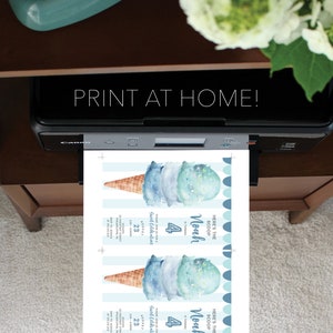 May include: A black Canon printer outputting a sheet of paper with two identical ice cream themed birthday invitations. The invitations feature a watercolor ice cream cone, blue stripes, and text reading: Here's the scoop, Noah is turning 4.