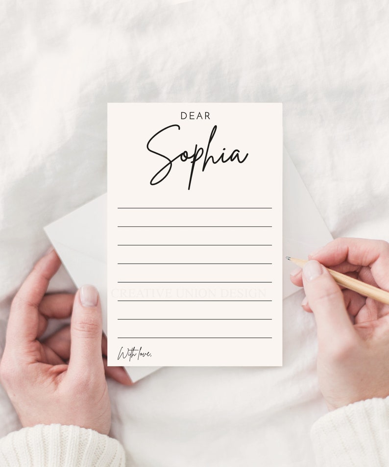 May include: A white card with black text that reads "Dear Sophia" and has lines for writing. The card also has the text "With love." at the bottom.
