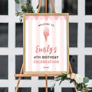 May include: A framed sign on an easel with a pink and white striped background. The sign reads "Welcome to Emily's 4th Birthday Celebration" with an ice cream cone graphic. The date 01.23.45 is at the bottom.