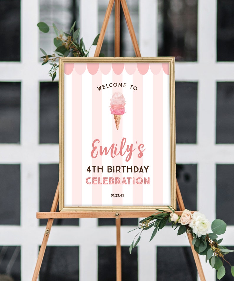 May include: A framed sign on an easel with a pink and white striped background. The sign reads "Welcome to Emily's 4th Birthday Celebration" with an ice cream cone graphic. The date 01.23.45 is at the bottom.