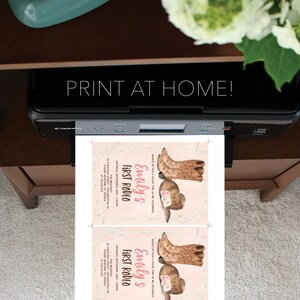 May include: Printable invitation for a first rodeo party with a pink background and a design of cowboy boots and a hat with flowers. The text reads "Saddle up for a good time as we celebrate Emily's First Rodeo" and includes the date, time, and location of the event.