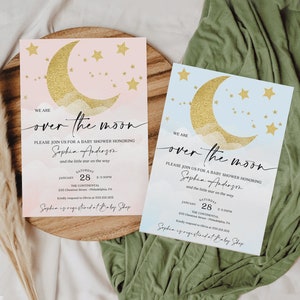 May include: Two baby shower invitations with a gold crescent moon and stars on a pink and blue watercolor background. The text reads "We are over the moon" and includes the name "Sophia Anderson" and details for the event.