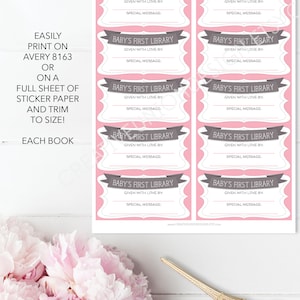 May include: Printable pink and gray baby's first library book labels. Each label has a space to write "Given with love by" and a special message. The text "Easily print on Avery 8163 or on a full sheet of sticker paper and trim to size! Each book" is printed on the left side of the image.
