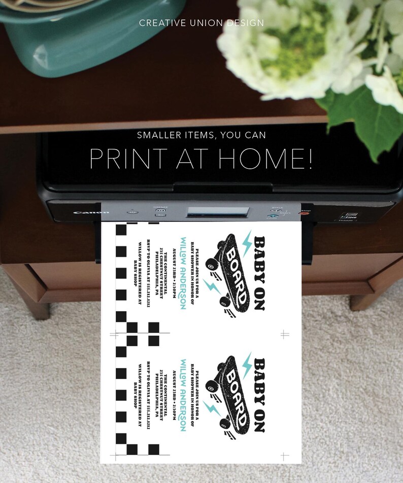 May include: Two printable baby shower invitations featuring a black and white skateboard graphic with the text "Baby on Board". The invitations are printed on white cardstock and have a blue and white chequered pattern on the back.