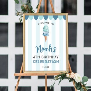 May include: Welcome to Noah's 4th Birthday Celebration sign with a blue and white striped background and a watercolor ice cream cone illustration.