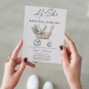 May include: A white gender reveal invitation card featuring a watercolor illustration of a wicker baby carriage with greenery. The text reads He or She, WHAT WILL BABY BE?, and includes event details for Sophia Anderson on September 23rd at 3:00 PM.