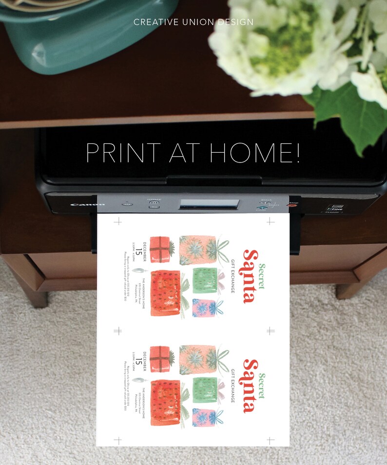 May include: A printer is shown printing a sheet with the words "PRINT AT HOME!" and "Secret Santa GIFT EXCHANGE." The printed sheet features watercolor illustrations of wrapped gifts in red, pink, green, and blue. The text "DECEMBER 15" is also visible.