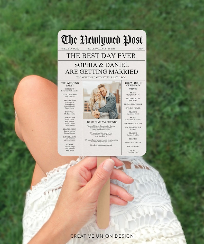 May include: A wedding program fan with a newspaper design. The headline reads "The Newlywed Post" and the subheading reads "The Best Day Ever." The program lists the wedding party, ceremony details, and a message to family and friends. A photo of the couple is included.