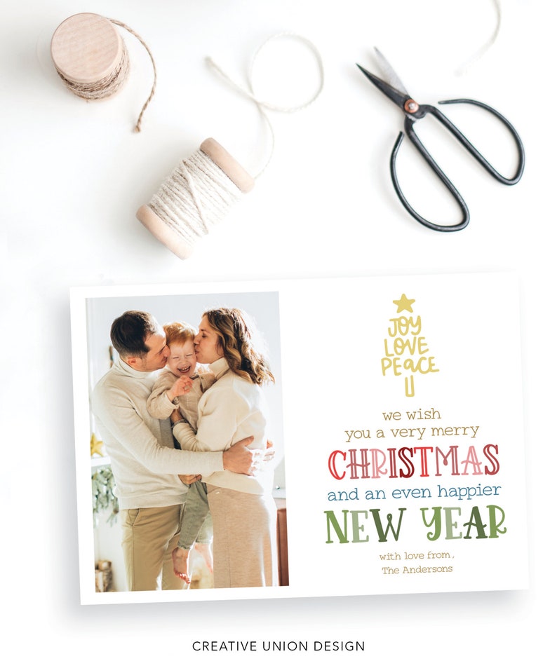 May include: A rectangular holiday greeting card featuring a photograph of a family of three on the left and text on the right. The text reads: JOY LOVE PEACE, we wish you a very merry CHRISTMAS and an even happier NEW YEAR with love from, The Andersons.