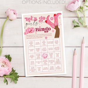 May include: Pink and white printable bingo card with the text "Let's go girls Bingo" and a list of prompts for a bachelorette party game.