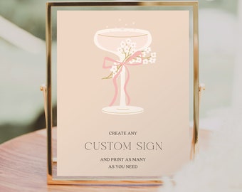 May include: A printable sign with a champagne glass illustration and pink ribbon. The text reads "Create any Custom Sign and print as many as you need." Below the text is "Creative Union Design."