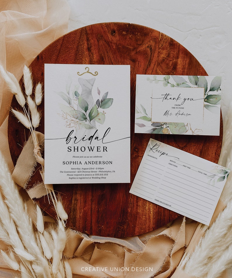 May include: A bridal shower invitation with a watercolor design of a dress, greenery, and gold accents. The invitation includes the text "bridal shower", "Sophia Anderson", and the date and time of the event. There is also a thank you card with the text "Thank you from the future Mrs. Anderson" and a recipe card with the text "Recipe".