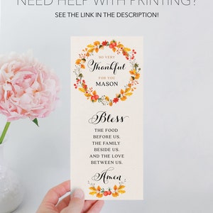 May include: A printable Thanksgiving place card with a fall-themed wreath and the text "So very Thankful for you Mason Bless the food before us. The family beside us. And the love between us. Amen."