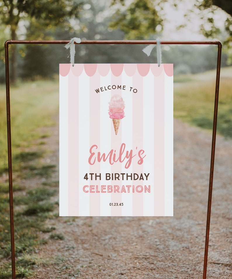 May include: A pink and white striped welcome sign for Emily's 4th birthday celebration. The sign features an ice cream cone graphic and the text "Welcome to Emily's 4th Birthday Celebration 01.23.45". The sign is hanging on a brown metal frame.