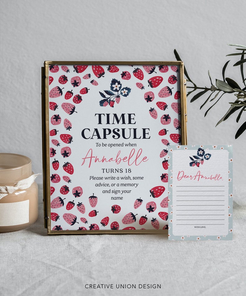 May include: A white card with a strawberry pattern and the text "Time Capsule" and "To be opened when Annabelle turns 18".  The card also includes instructions to write a wish, some advice, or a memory and sign your name.  A second card with a strawberry pattern and the text "Dear Annabelle" is also shown.