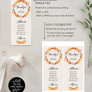May include: Printable Thanksgiving place cards with a fall floral wreath design. The cards feature the text "So Very Thankful for You Mason" and "Bless the food before us, the family beside us, and the love between us. Amen".