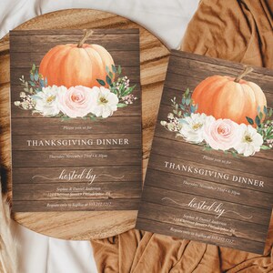 May include: Two Thanksgiving dinner invitations with a rustic wood background. Each card features an orange pumpkin, white and pink flowers, and text that reads "Thanksgiving Dinner" and "hosted by".