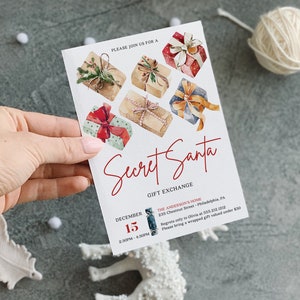 May include: A white rectangular Secret Santa gift exchange invitation card featuring watercolor illustrations of six wrapped presents with ribbons. The text reads: Secret Santa, Gift Exchange, December 15, 2:30PM - 4:30PM, The Anderson's Home, 235 Chestnut Street, Philadelphia, PA, and details regarding a gift valued under $30.